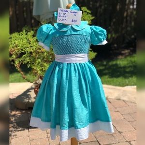 Custom, hand-made silk smocked girls dress